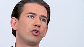 In this file photo taken on September 08, 2021 Austrian Chancellor Sebastian Kurz addresses a press conference .