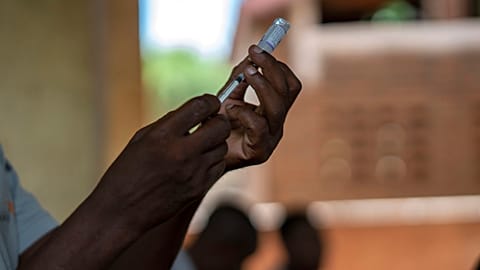 Health officials prepare to vaccine residents of the Malawi village of Tomali.