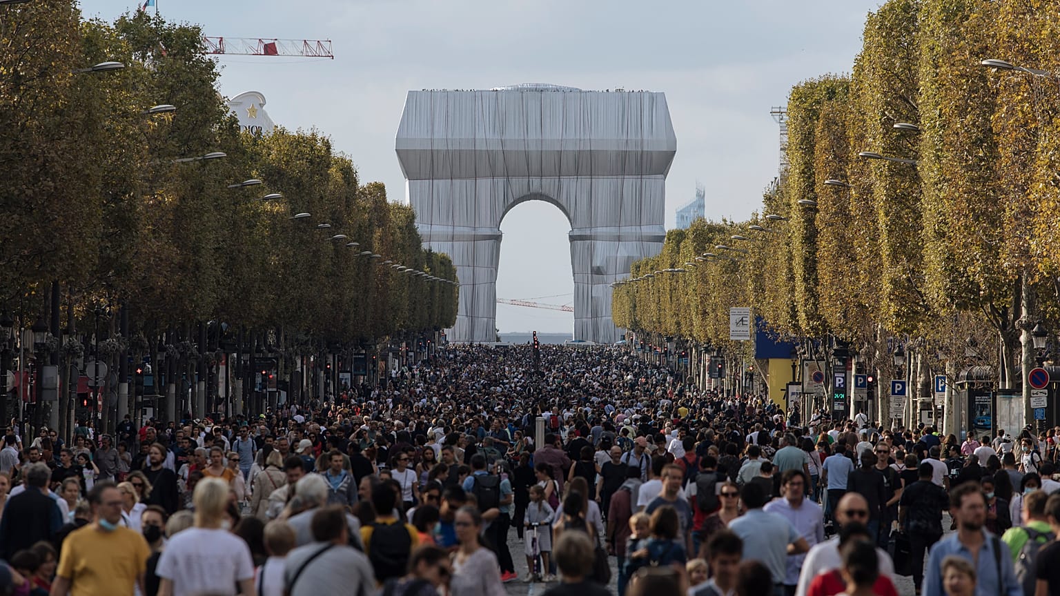 Pedestrians walking along the Champs-Elysees on Paris's car-free day 2021,