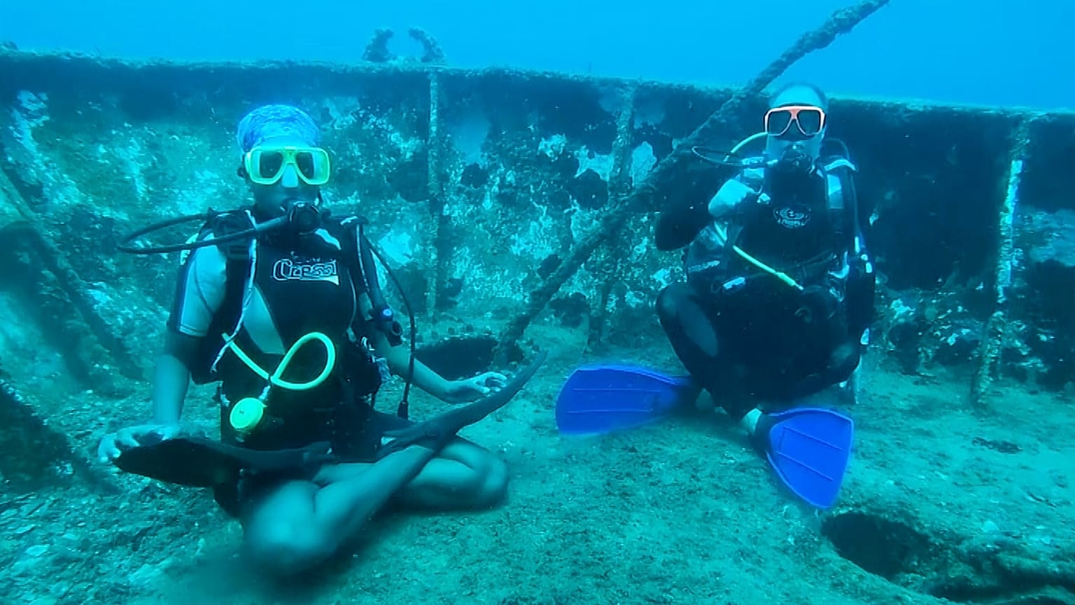 Divers practise yoga under the Caribbean sea