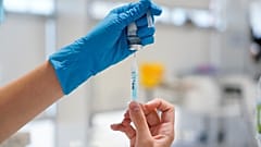 A nurse prepares a syringe with a dose of the Moderna COVID vaccine at Enfermera Isabel Zendal hospital in Madrid, Spain, July 23, 2021.