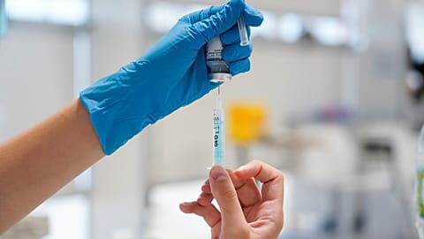 A nurse prepares a syringe with a dose of the Moderna COVID vaccine at Enfermera Isabel Zendal hospital in Madrid, Spain, July 23, 2021.