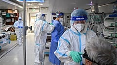 Medical personnel give assistance to a Covid-19 patient inside the mobile intensive care unit of the "Pneumophysiology Institute Prof Dr Marius Nasta" in Bucharest, 07/10/2021
