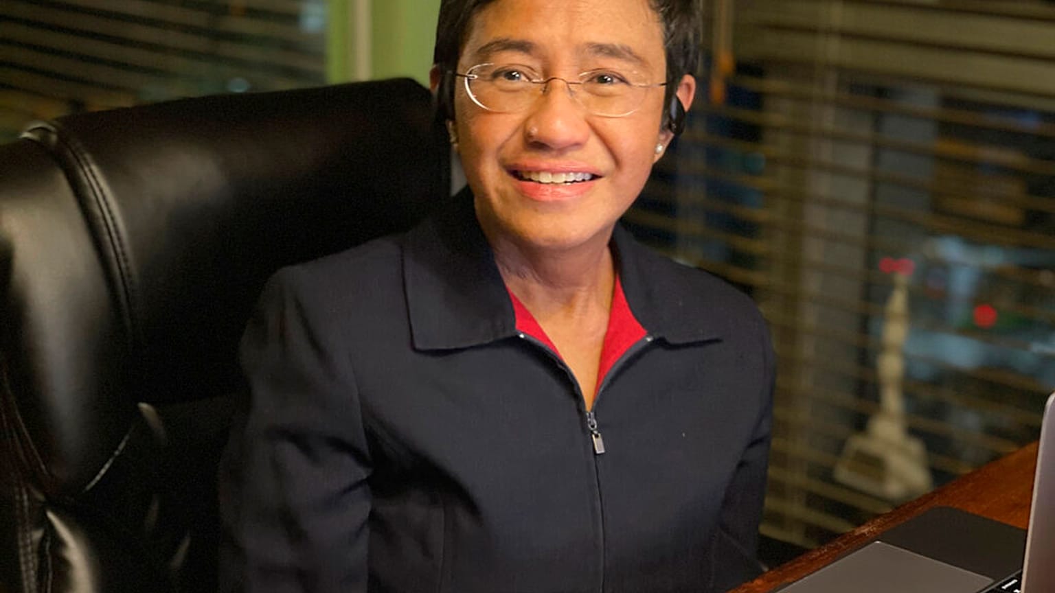 In this photo provided by the Rappler, Rappler CEO and Executive Editor Maria Ressa smiles at her home after being awarded the Nobel Peace Prize