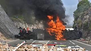 Protesters set fire to car tires at one of the blockades near Cetinje, Montenegro, Sunday, Sept. 5, 2021.