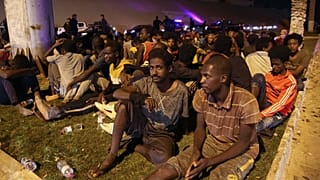 Migrants recaptured by Libyan security forces following an escape attempt from a detention centre in the capital Tripoli, October 8, 2021. Guards shot six migrants dead. 