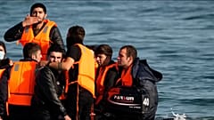 Migrants seen leaving France on boats for UK