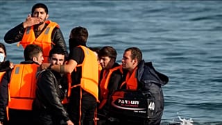 Migrants seen leaving France on boats for UK
