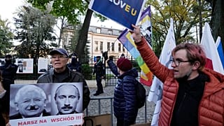 People stage a protest in front of Poland's constitutional court, in Warsaw, Poland, Thursday, October 7, 2021.