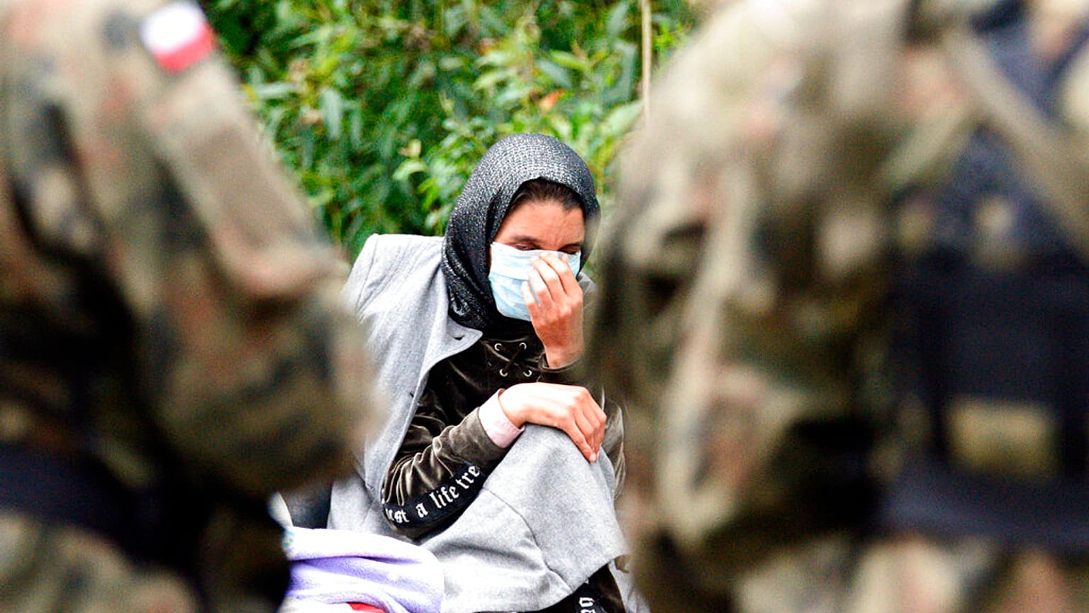 Migrants are seen after crossing the border from Belarus into Poland in the village of Usnarz Gorny, Poland, on Thursday Aug.19, 2021.