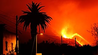 A volcano continues to spew out lava on the Canary island of La Palma, Spain in the early hours of Sunday, Oct. 10, 2021.