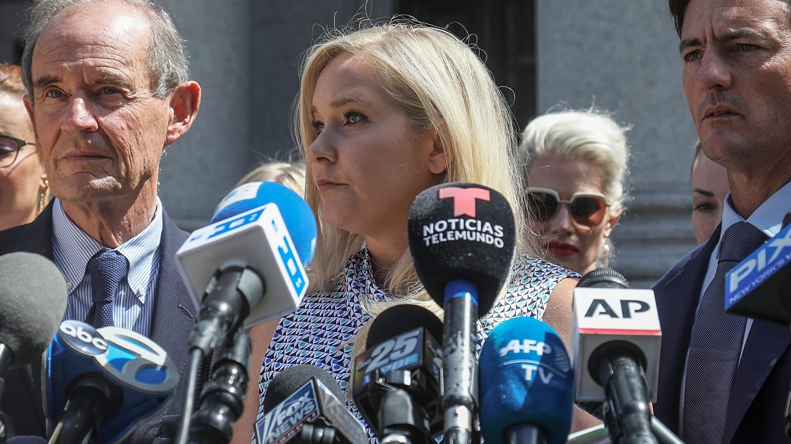In this file photo from 2019, Virginia Giuffre, who says she was trafficked by sex offender Jeffrey Epstein, holds a news conference outside a Manhattan court in New York.