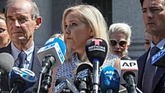 In this file photo from 2019, Virginia Giuffre, who says she was trafficked by sex offender Jeffrey Epstein, holds a news conference outside a Manhattan court in New York.