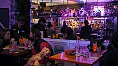 Patrons eat and drink inside a bar in Sydney on October 11, 2021, as Sydney ended their lockdown against the Covid-19 coronavirus after 106 days.