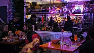 Patrons eat and drink inside a bar in Sydney on October 11, 2021, as Sydney ended their lockdown against the Covid-19 coronavirus after 106 days.