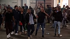 Forza Nuova leader Giuliano Castellino (C) shout during clashes after a protest against the compulsory "green pass" to limit the spread of COVID-19, Rome, October 9, 2021.