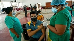A Sri Lankan university student receives his coronavirus vaccine at the Sri Jayawardenapura university in Colombo, Sri Lanka, Monday, Oct. 11, 2021. 
