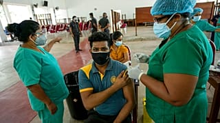 A Sri Lankan university student receives his coronavirus vaccine at the Sri Jayawardenapura university in Colombo, Sri Lanka, Monday, Oct. 11, 2021. 
