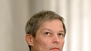 Romania's prime minister Dacian Ciolos looks up during the swearing-in ceremony of the new government in Bucharest, Romania, Tuesday, Nov. 17, 2015