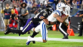 Indianapolis Colts wide receiver Michael Pittman (11) leans for a touchdown with Baltimore Ravens cornerback Marlon Humphrey (44) on his back