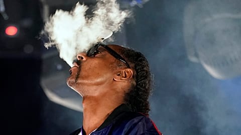 FILE- Snoop Dogg performs a DJ set as "DJ Snoopadelic" during the "Concerts In Your Car" series at the Ventura County Fairgrounds