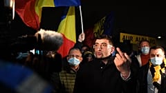 George Simion, the leader and parliament member of nationalist party AUR (The Alliance for the Unity of Romanians) gestures during a protest in Bucharest.