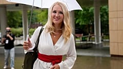 Dr. Anastasia Vasilyeva smiles as she arrives at the court room in Moscow in August.
