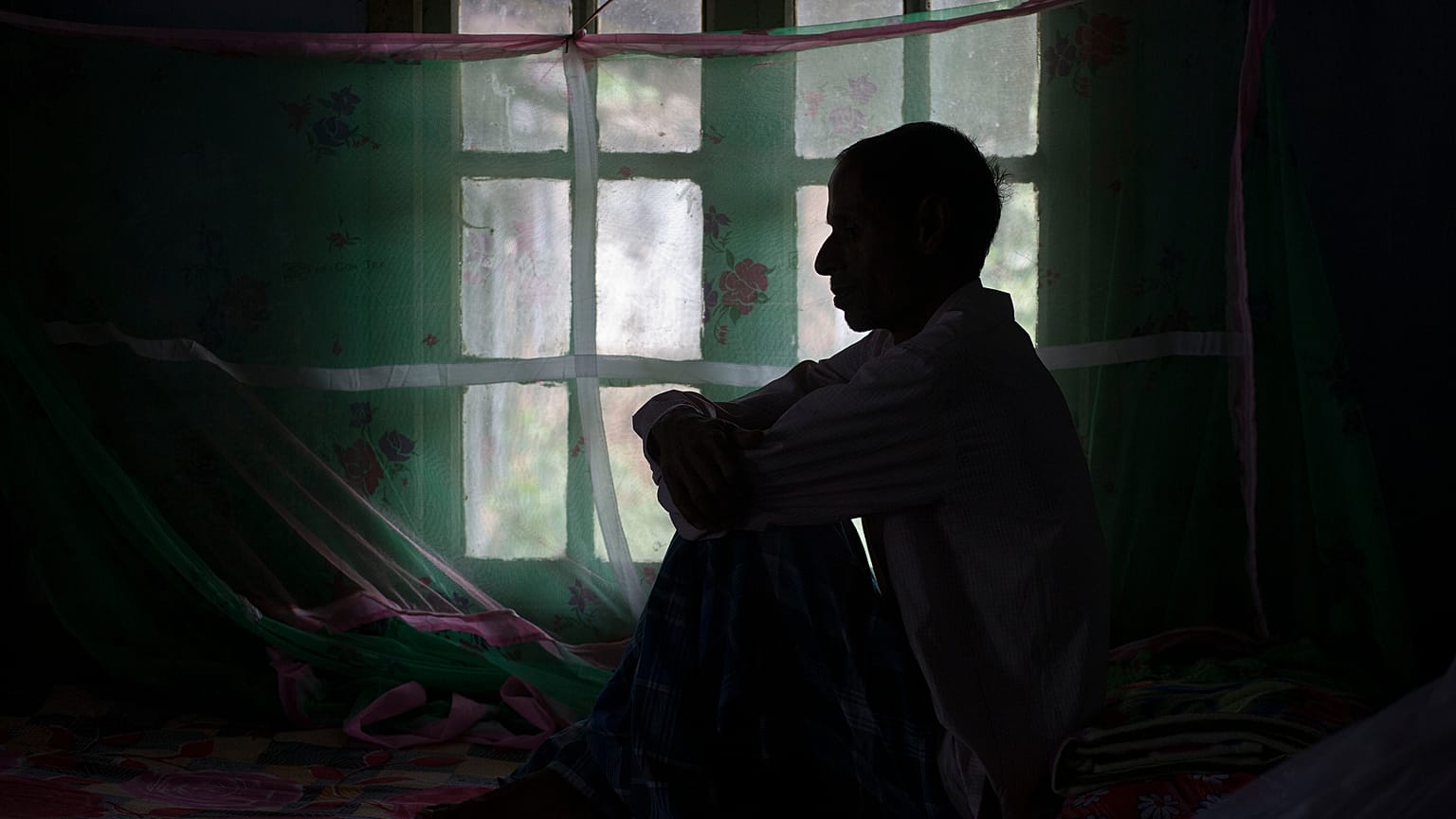 In this March 24, 2018 file photo, a tuberculosis patient sits on a bed at a TB hospital in Gauhati, India.