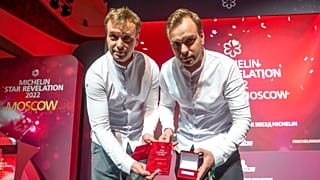 Twins, Garden chefs Ivan and Sergey Berezutsky, who received two Michelin stars, show their award as they take part in the award ceremony, which took place in Moscow.