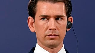 Austria's Chancellor Sebastian Kurz listens Serbian President Aleksandar Vucic during a press conference after their talks in Belgrade, Serbia, Saturday, Sept. 4, 2021