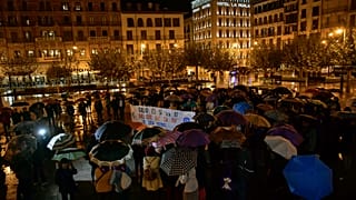 In this Monday, Nov. 4, 2019 file photo, a woman holds a sign that reads: "Only Yes is Yes", as people gather at Plaza del Castillo square in Pamplona, Spain.
