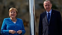German Chancellor Angela Merkel, left, is welcomed by Turkish President Recep Tayyip Erdogan on the occasion of their meeting at Huber Villa presidential palace, in Istanbul.
