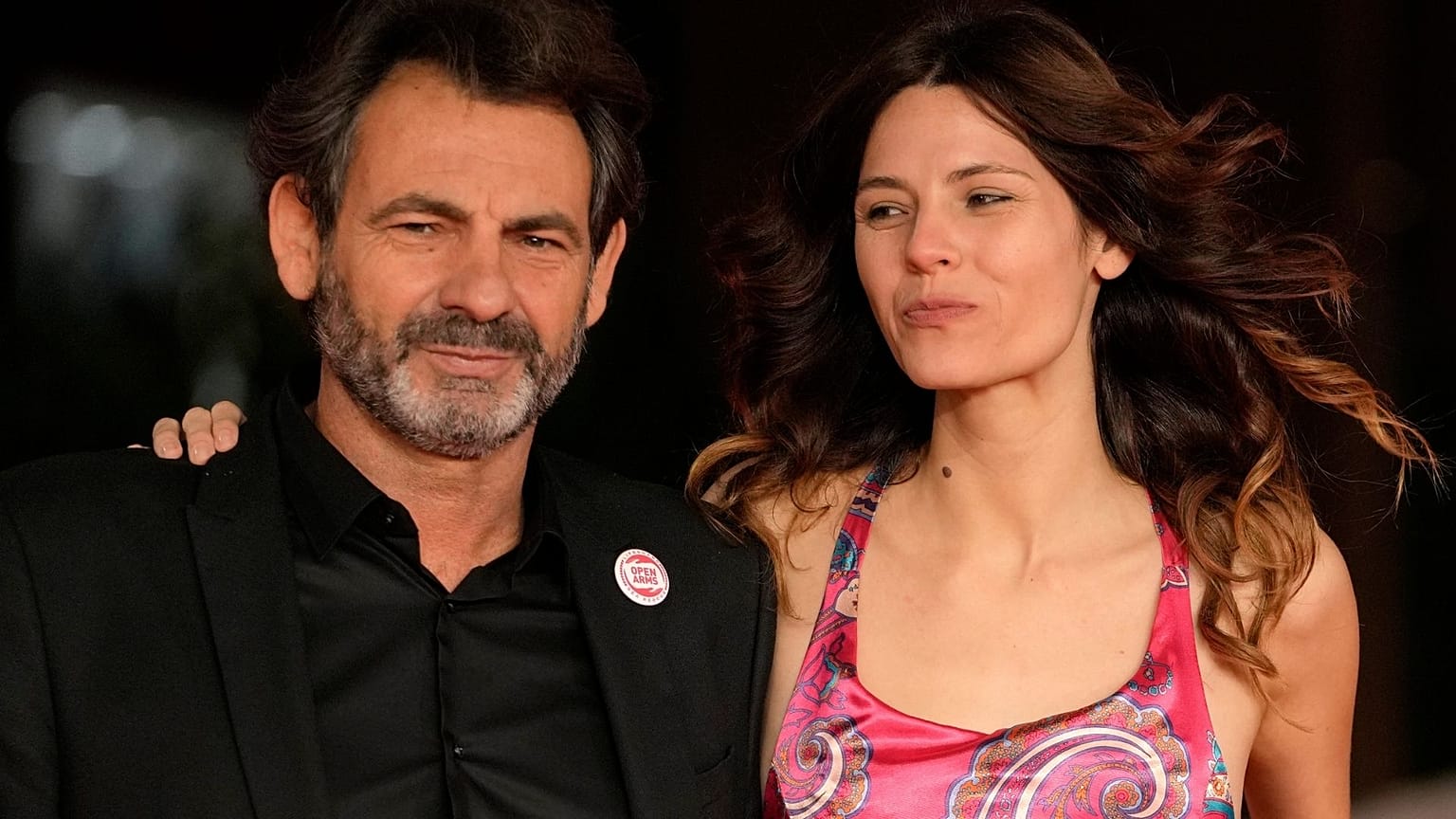 Open Arms founder Oscar Camps and his partner Marlene Fautsch pose during the red carpet for Mediterraneo