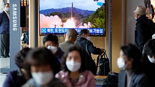 A TV screen showing a news program reporting about North Korea's missile launch with file footage is seen at a train station in Seoul, South Korea, Tuesday, Oct. 19, 2021.