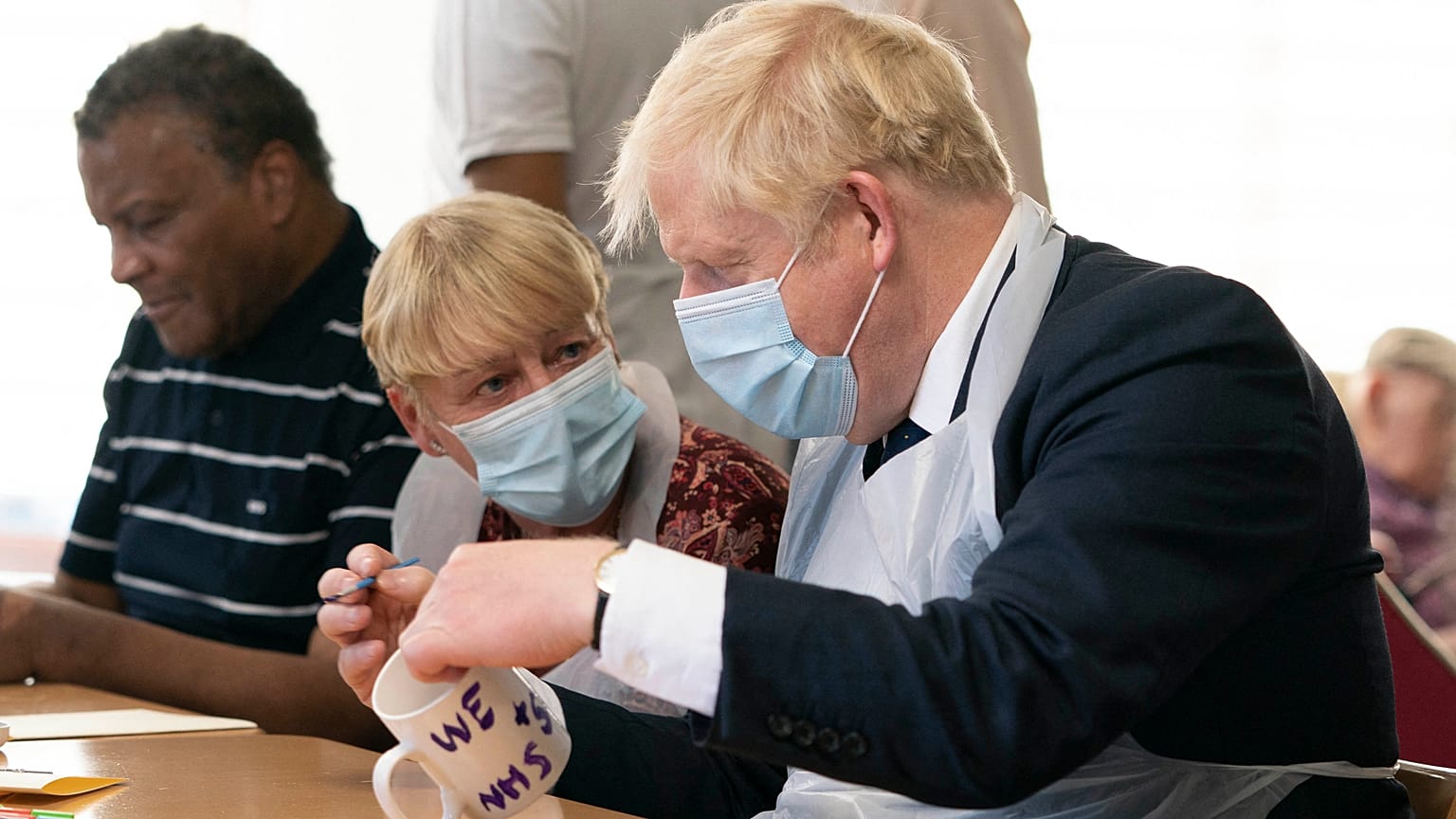 Britain's Prime Minister Boris Johnson during a visit to Westport Care Home in east London on September 7, 2021. 