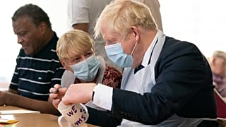 Britain's Prime Minister Boris Johnson during a visit to Westport Care Home in east London on September 7, 2021. 