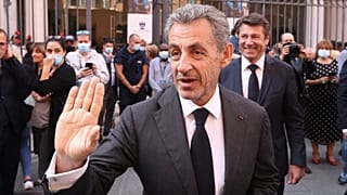 French former President Nicolas Sarkozy waves as he leaves after a tribute ceremony for Samuel Paty in Nice, 15 October 2021
