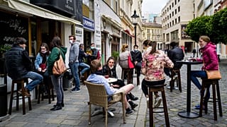 People sitting outside a cafe in Bratislava, Slovakia