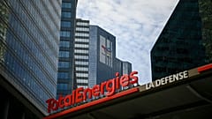 This photograph taken on May 28, 2021 shows the new TotalEnergies logo during its unveling ceremony, at a charging station in La Defense on the outskirts of Paris.