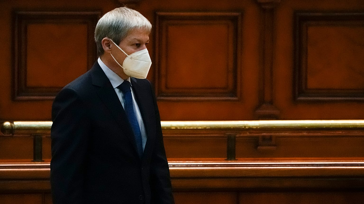 Romanian Prime Minister designate Dacian Ciolos stands before a parliament session on Wednesday.