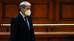 Romanian Prime Minister designate Dacian Ciolos stands before a parliament session on Wednesday.