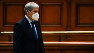 Romanian Prime Minister designate Dacian Ciolos stands before a parliament session on Wednesday.