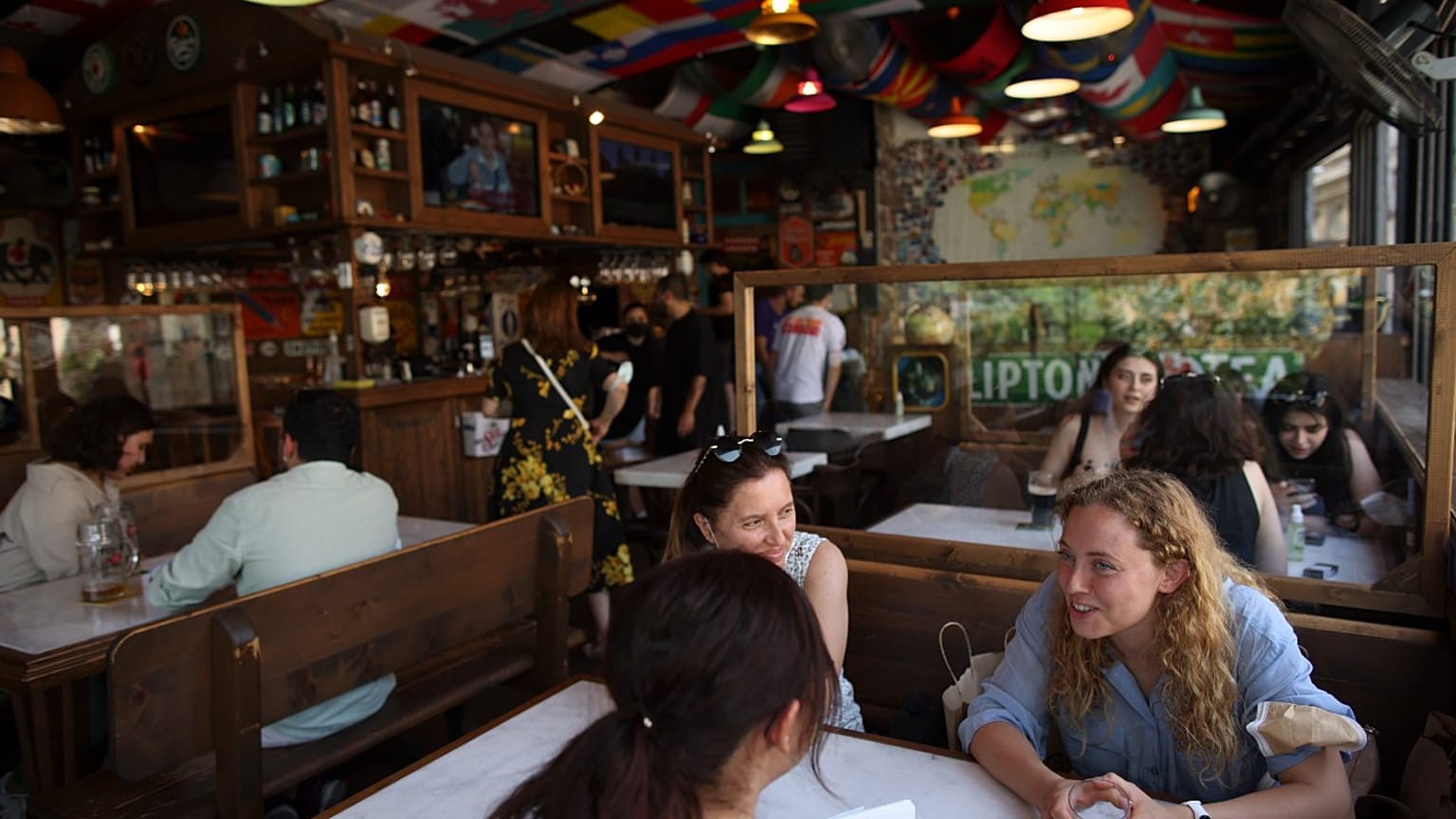 People have fun in a restaurant in Istanbul, Thursday, July 1, 2021.