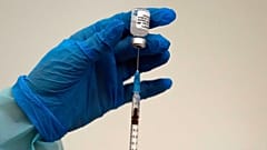 A medical worker prepares a shot of Pfizer COVID-19 vaccine, at Belgrade Fair makeshift center in Belgrade, Serbia, Saturday, Oct. 2, 2021