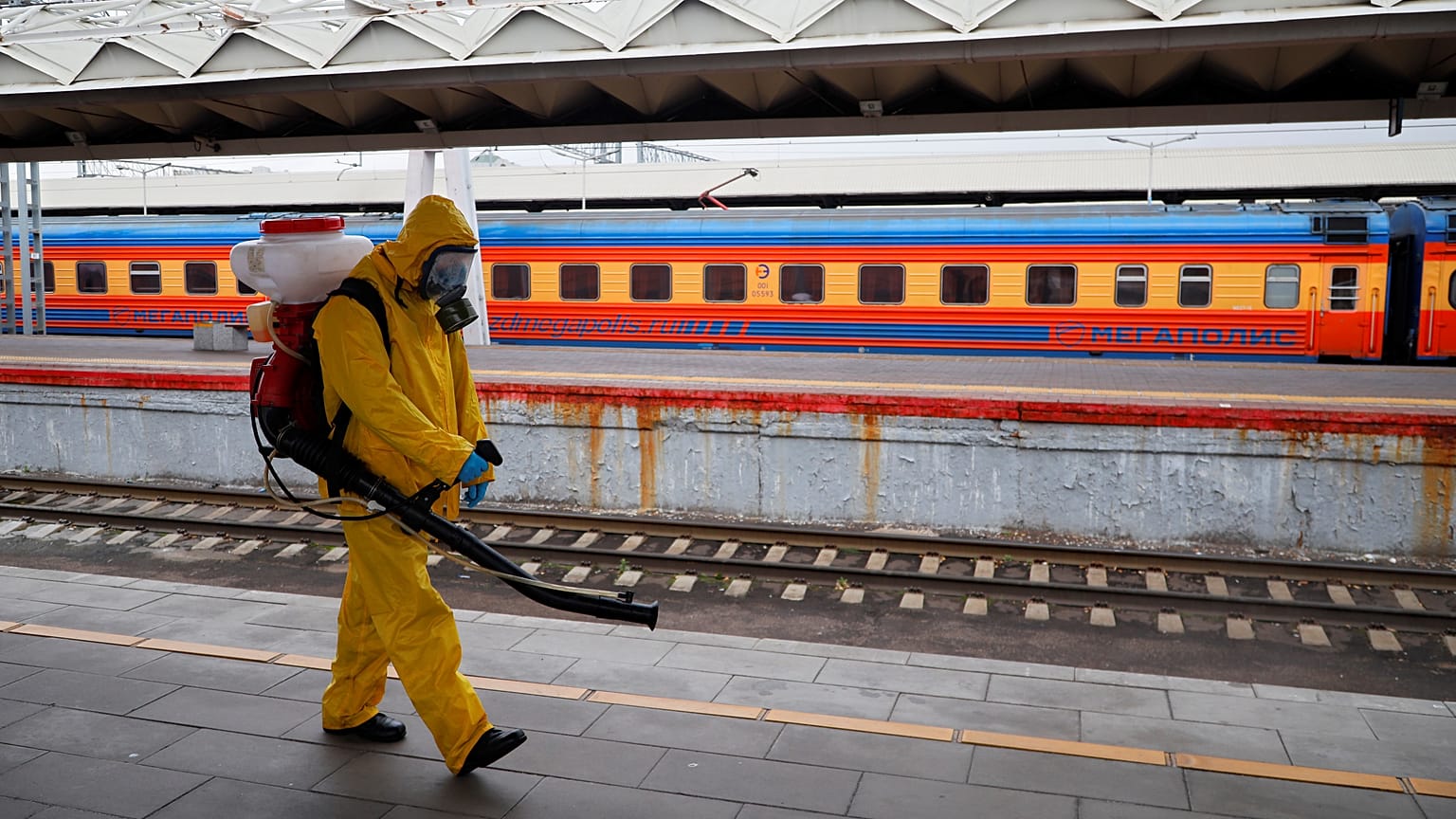 An emergency worker disinfects Leningradsky railway station in Moscow