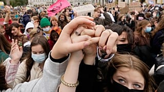 Environmental activists, many of them students, rallying in Warsaw, Poland, on Friday, Sept. 24, 2021 as part of a global action to demand that leaders take stronger measures 