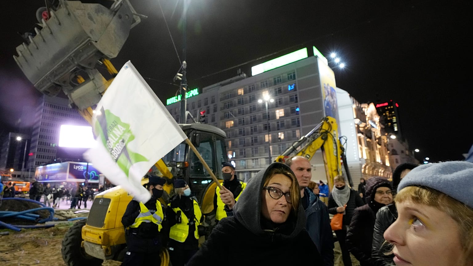 Protesters gather near the Polish capital's iconic skyscraper, the Palace of Culture, at a protest demanding abortion rights, in Warsaw, Poland, on Friday Oct. 22, 2021.