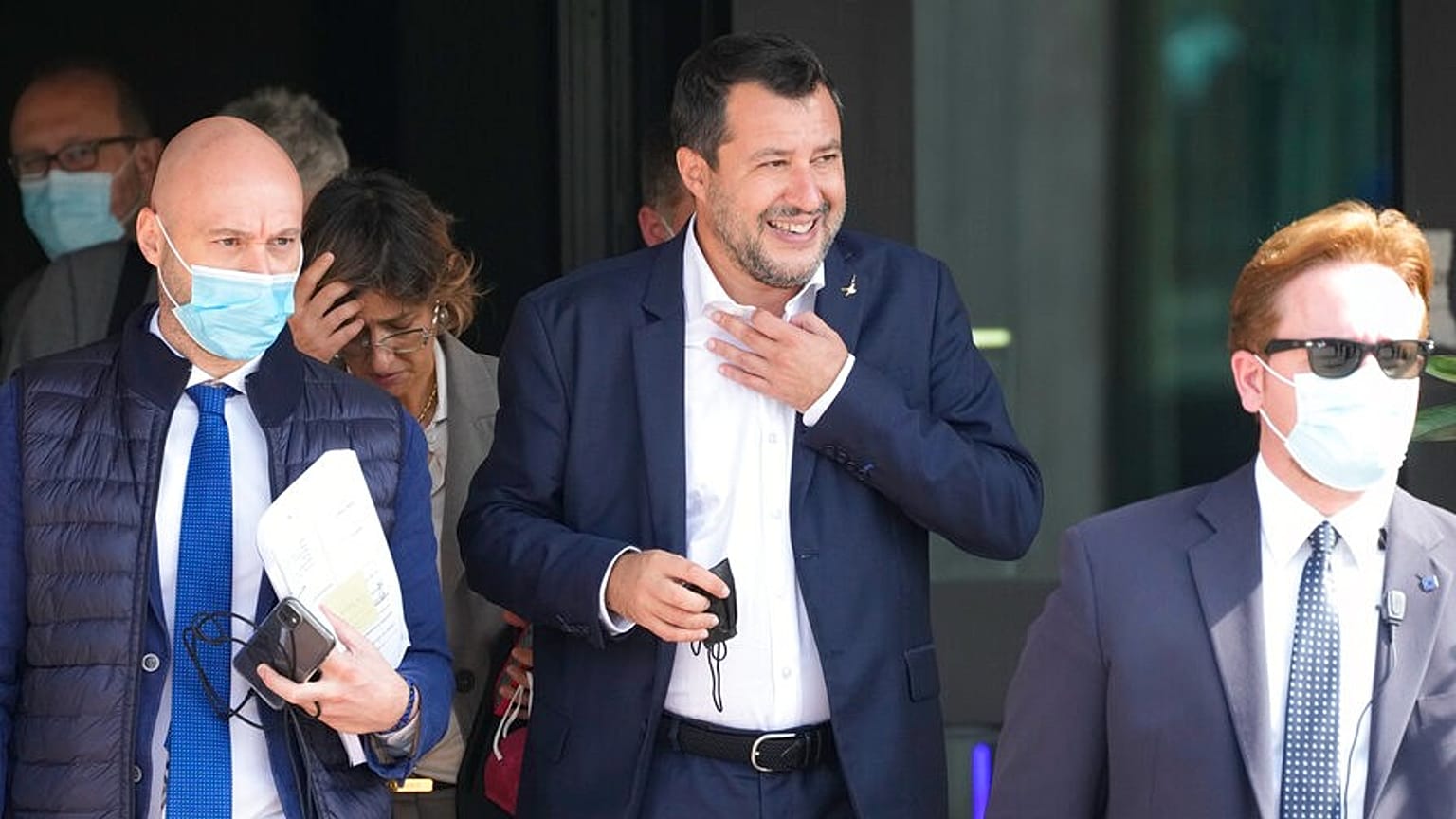 Former minister of interior Matteo Salvini, center, leaves the Palermo's court, Italy, Saturday, Oct. 23, 2021.