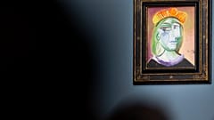 Pablo Picasso's "Femme au béret rouge-orange" is on display for auction at the Bellagio hotel and casino Saturday, Oct. 23, 2021, in Las Vegas. 