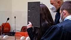Defendant Jennifer W. arrives in a courtroom for her trial in Munich, Germany, Monday, Oct. 25, 2021. 